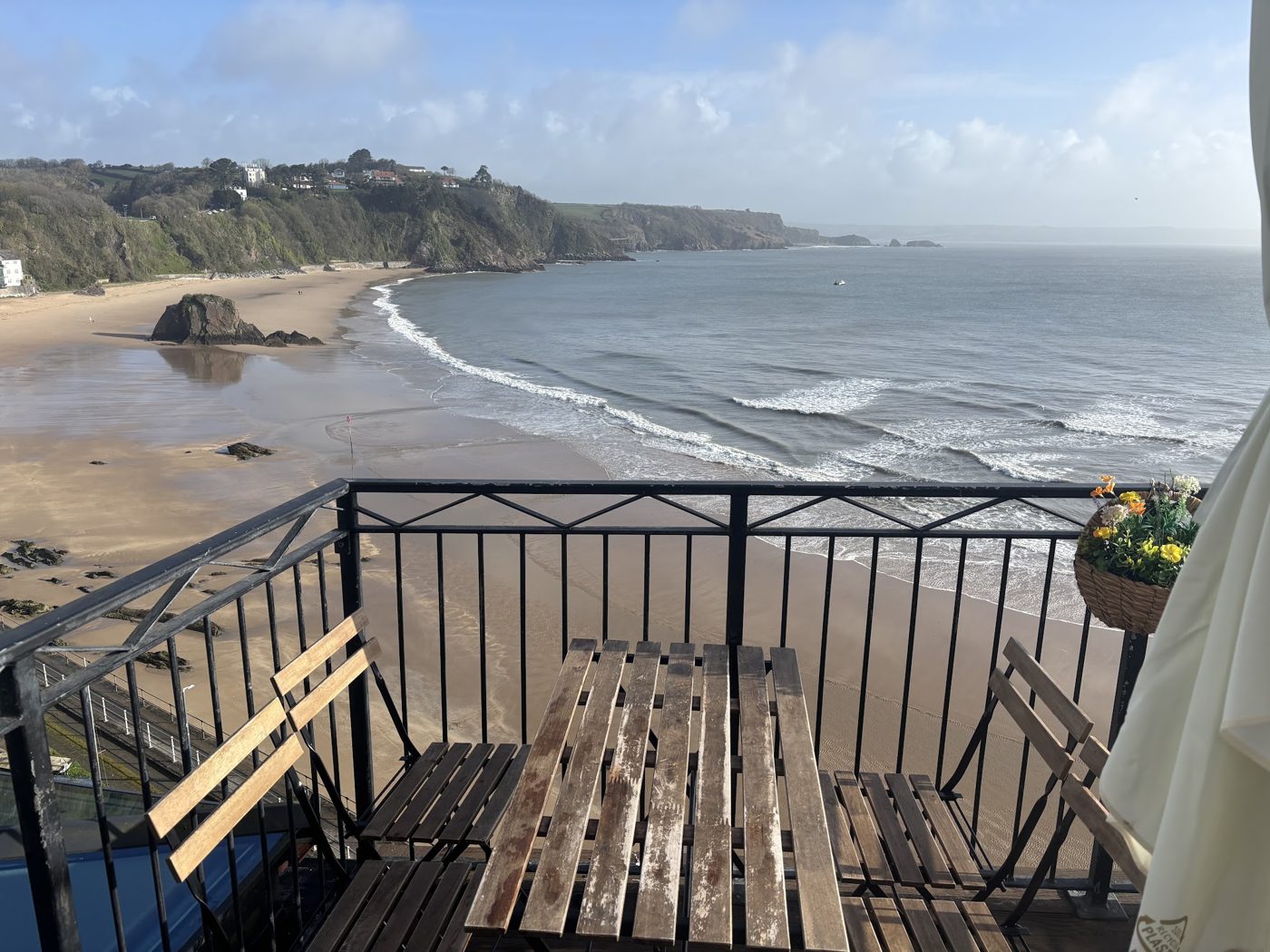 The terrace, with tables looking over the beach and the sea